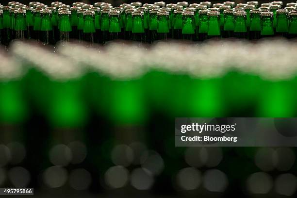 Six packs of Beck's lager beer bottles move along the production line at the Beck's brewery, operated by Anheuser-Busch InBev NV, in Bremen, Germany,...