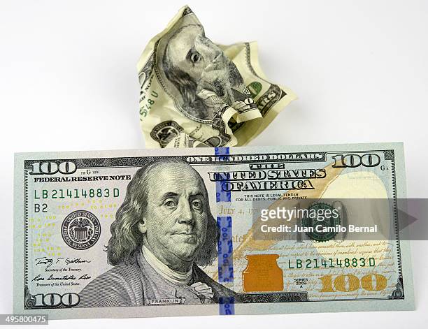 new one hundred dollar bill next to an old one - 100 dollar bill new stock pictures, royalty-free photos & images