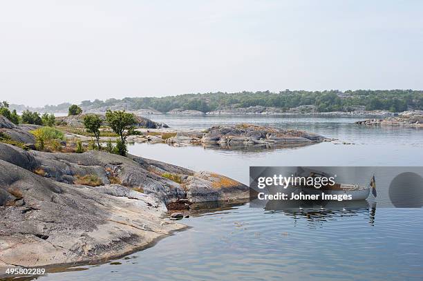 moored motorboat, stora nassa, sweden - archipelago stock pictures, royalty-free photos & images