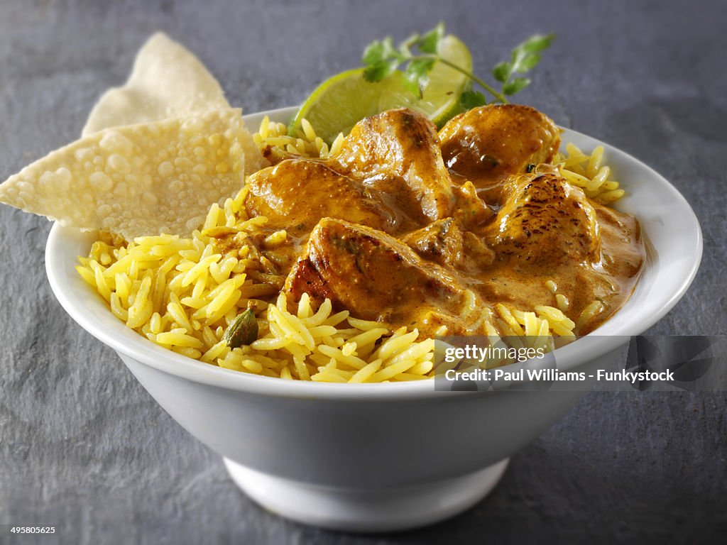 Chicken Bhuna Indian curry, pilau rice and papadums