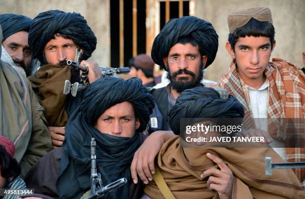 In this photograph taken on November 3 Afghan Taliban fighters look on as they listen to Mullah Mohammad Rasool Akhund , the newly appointed leader...