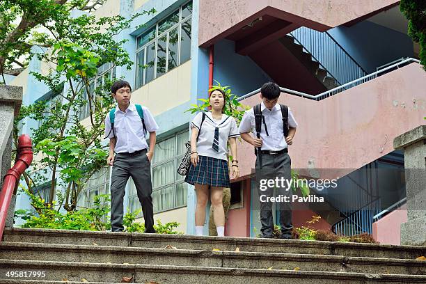 students walking in hong kong - bagpack stock pictures, royalty-free photos & images