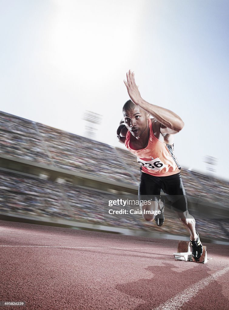 Sprinter taking off from starting block