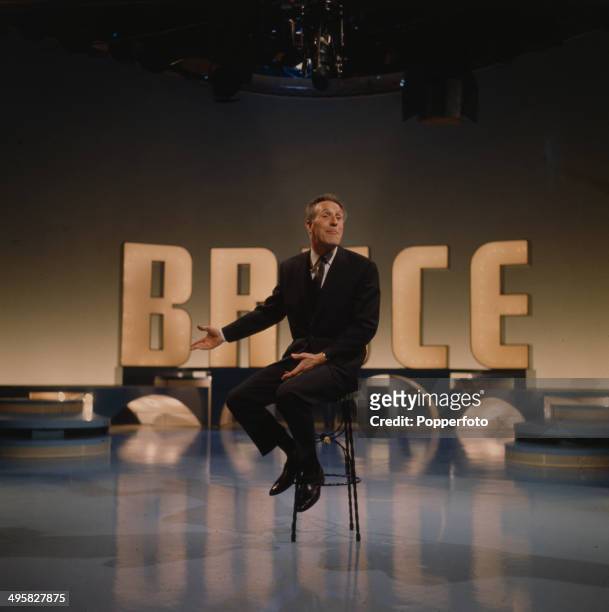 English entertainer and presenter Bruce Forsyth performs on the set of his television series 'The Bruce Forsyth Show' in 1966.
