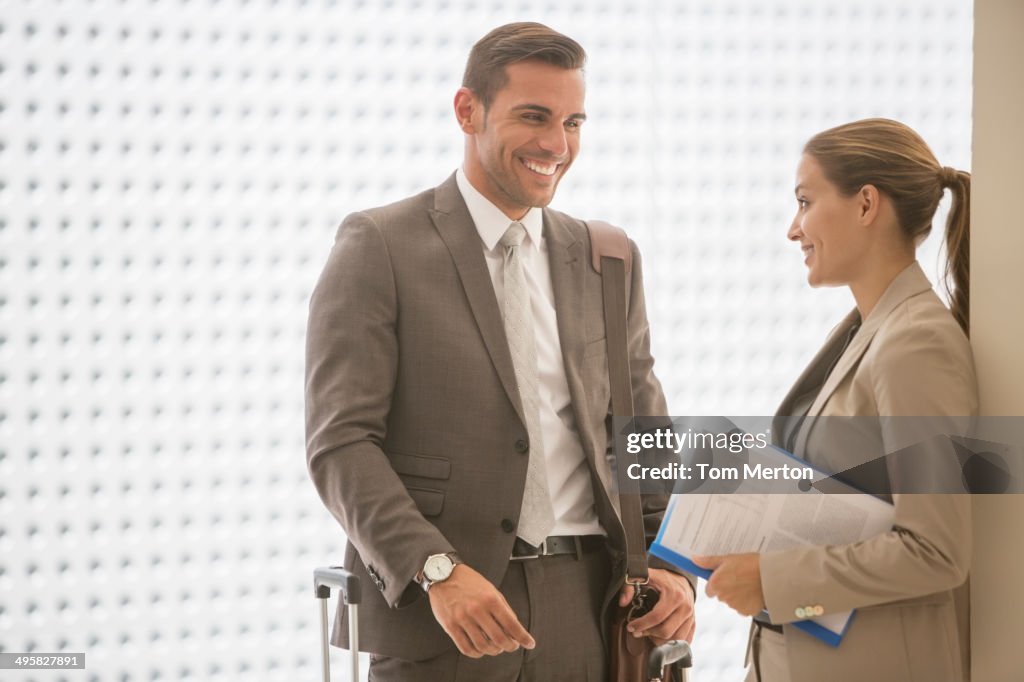 Business people talking in corridor