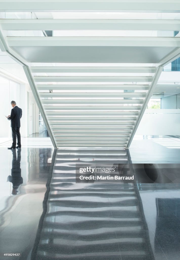 Businessman in modern lobby