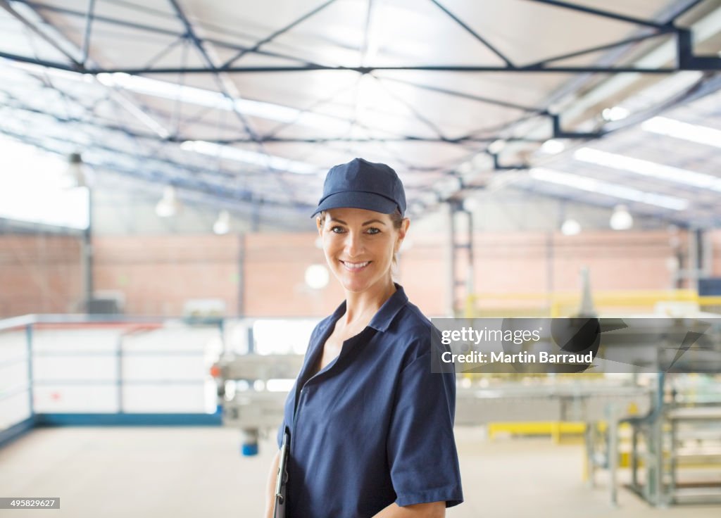 Portrait of confident worker in food processing plant