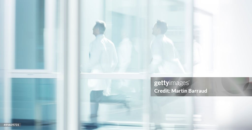Doctors running in hospital corridor