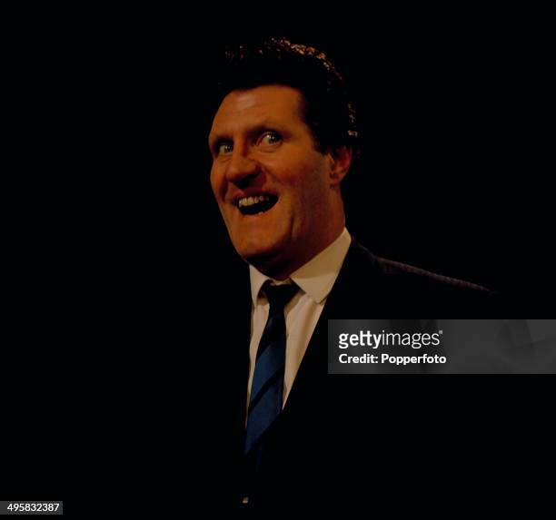 British comedian and magician Tommy Cooper performs in a sketch on his television series 'Cooperama' in 1966.