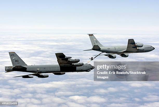 a b-52h stratofortress refuels with a kc-135r stratotanker. - explosive stock pictures, royalty-free photos & images