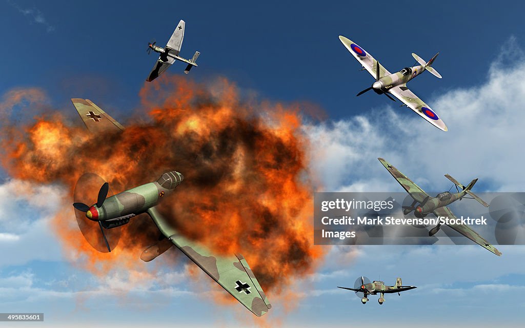 A Royal Air Force Supermarine Spitfire fighter aircraft attacking German Stuka dive bombers during the Battle of Britain.