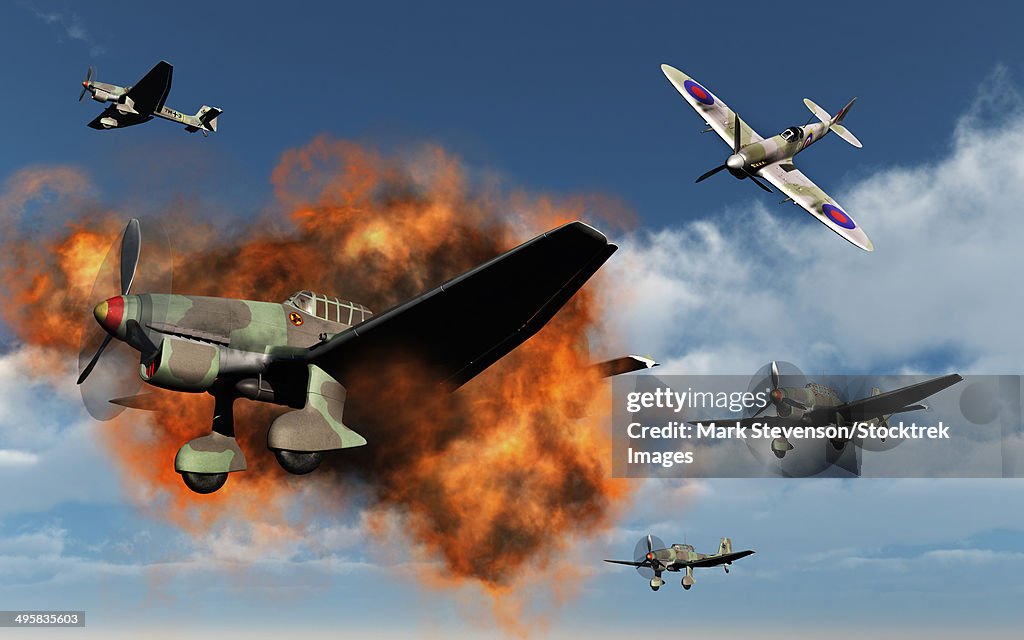 A Royal Air Force Supermarine Spitfire fighter aircraft attacking German Stuka dive bombers during the Battle of Britain.