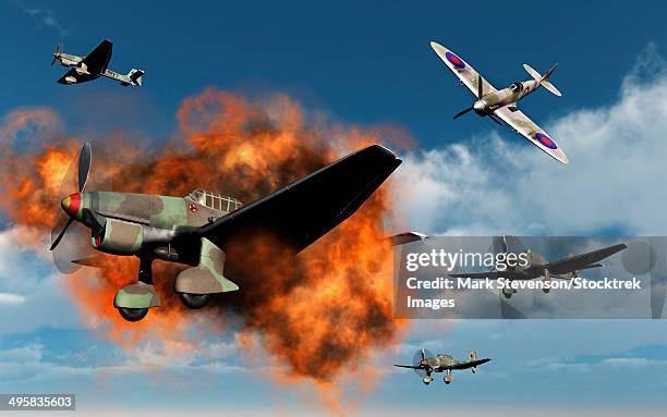 a royal air force supermarine spitfire fighter aircraft attacking german stuka dive bombers during the battle of britain. - battle of britain stock illustrations