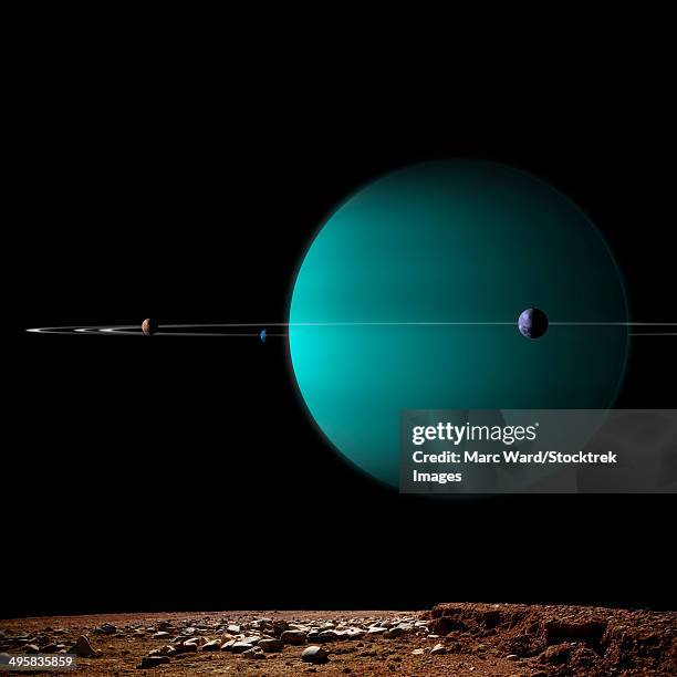 artist's depiction of a ringed gas giant planet surrounded by it's moons. - astrobiology stock illustrations