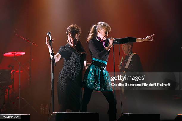 Singer Arielle Dombasle and her first Part, Singer of the Group 'Hillbilly Moon Explosion', Emanuela Hutter perform at La Cigale on November 4, 2015...