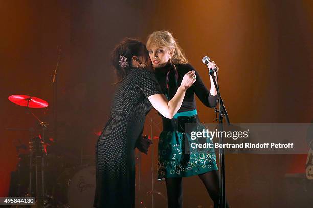 Singer Arielle Dombasle and her first Part, Singer of the Group 'Hillbilly Moon Explosion', Emanuela Hutter perform at La Cigale on November 4, 2015...