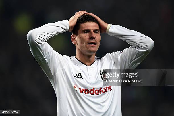 Besiktas' German forward Mario Gomez reacts after missing a goal during the UEFA Europa League group H football match between Besiktas Istanbul and...