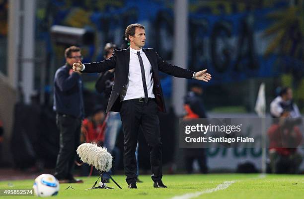 Rodolfo Arruabarrena head coach of Boca Juniors gives instructions to his players during a final match between Boca Juniors and Rosario Central as...