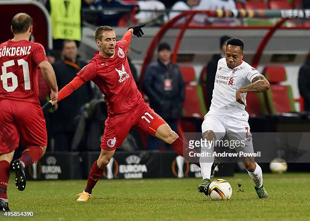 Nathaniel Clyne of Liverpool competes with Marko Devic of Rubin Kazan during the UEFA Europa League match between FC Rubin Kazan and Liverpool FC on...