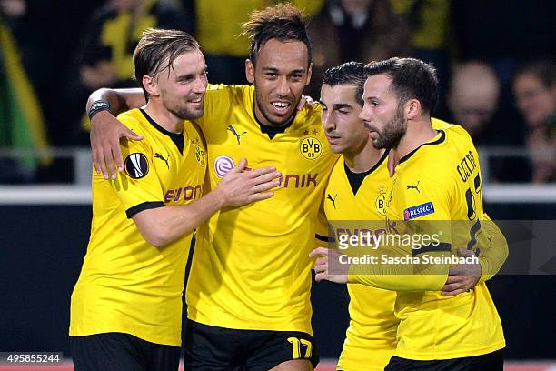 Pierre-Emerick Aubameyang celebrates with team mates Marcel Schmelzer , Henrikh Mkhitaryan and Gonzalo Castro of Dortmund after scoring his team's...
