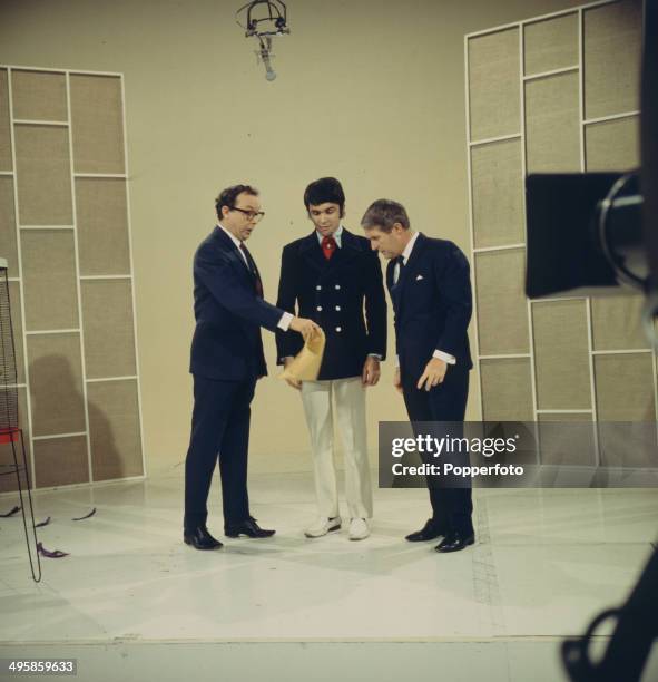 English comic duo Eric Morecambe and Ernie Wise of Morecambe and Wise pose with Dave Clark from the Dave Clark Five on their television series 'The...