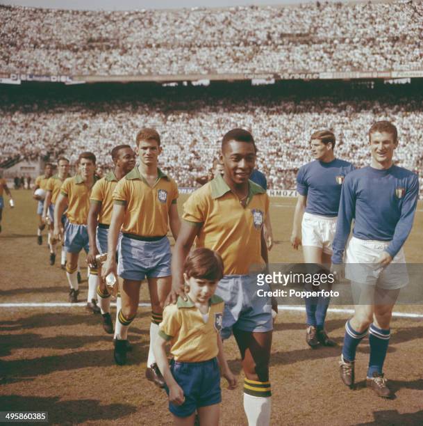 Pele leads the Brazil national team out on to the pitch before the international game with Italy at the San Siro stadium in Milan, Italy on 12th May...