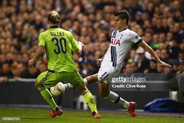 Erik Lamela of Spurs is challenged by Guillaume Gillet of Anderlecht during the UEFA Europa League Group J match between Tottenham Hotspur FC and RSC...