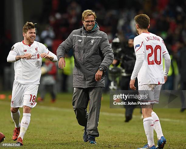 Jurgen Klopp manager of Liverpool with Alberto Moreno and Adam Lallana at the end of the UEFA Europa League match between FC Rubin Kazan and...