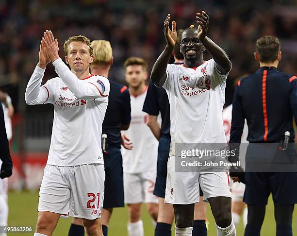 Mamadou Sakho and Lucas Leiva of Liverpool show their appreciation to the fans at the end during the UEFA Europa League match between FC Rubin Kazan...