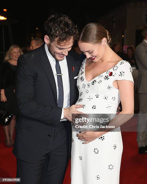 Actor Sam Claflin and Laura Haddock attend "The Hunger Games: Mockingjay Part 2" UK Premiere at the Odeon Leicester Square on November 5, 2015 in...