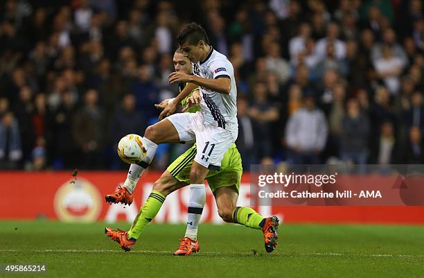 Erik Lamela of Tottenham Hotspur and Guillaume Gillet of Anderlecht during the UEFA Europa League match between Tottenham Hotspur and RSC Anderlecht...