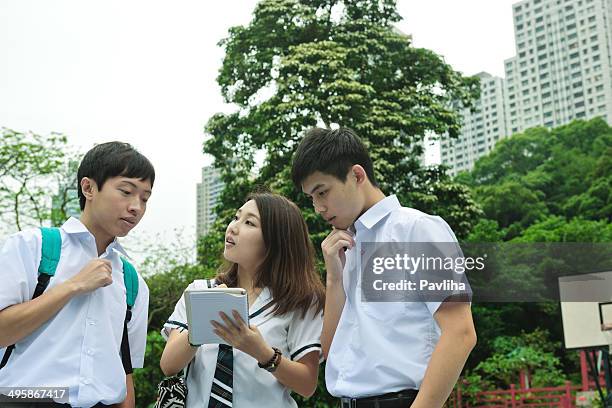 students walking in hong kong - bagpack stock pictures, royalty-free photos & images