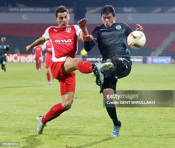 Sporting's Argentinian defender Jonathan Silva vies with Skenderbeu's Albanian defender Kristi Vangjeli during the UEFA Europa League football match...