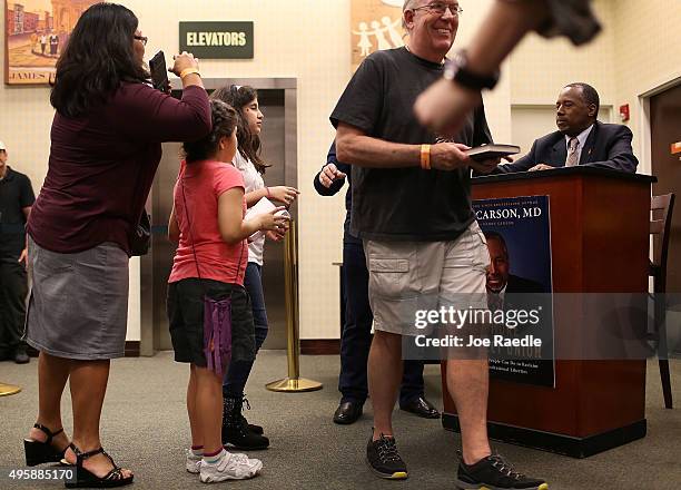 Republican presidential candidate Ben Carson signs his book at a Barnes and Noble store on November 5, 2015 in Fort Lauderdale, Florida. Mr. Carson...