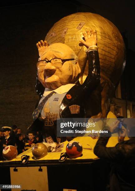 Celebrity effigy of FIFA President Sepp Blatter is paraded by members of local Bonfire societies through the streets of Lewes to celebrate Bonfire...