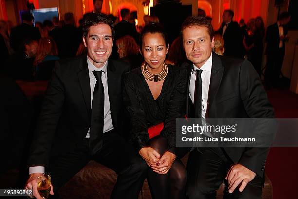 Roman Knizka , Minh-Khai Phan-Thi and a guest attend the GQ Men of the year Award 2015 after show party at Komische Oper on November 5, 2015 in...