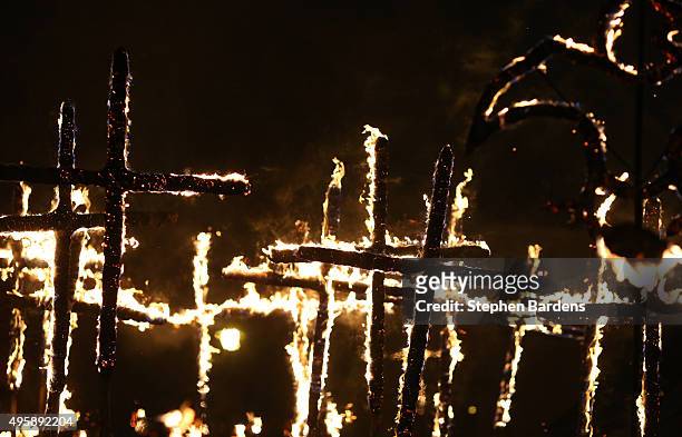 Members of local Bonfire societies parade through the streets of Lewes carrying lit crosses to celebrate Bonfire night on November 5, 2015 in Lewes,...