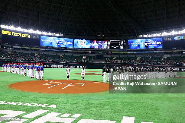 Japan playrs line up for national anthem during the send-off friendly match for WBSC Premier 12 between Japan and Puerto Rico at the Fukuoka Dome on...