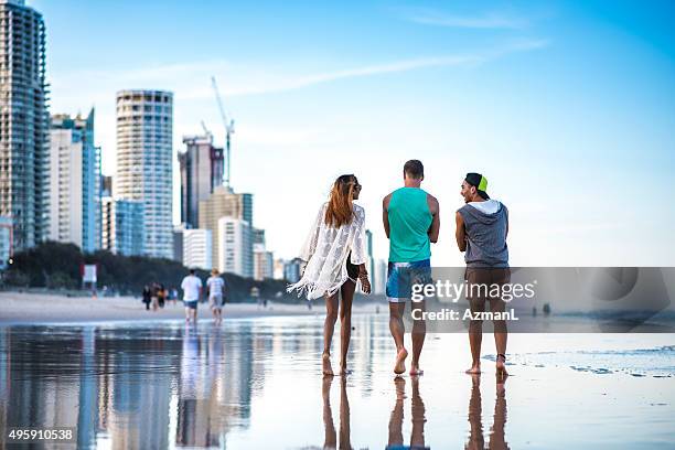 walk on the beach - gold coast queensland stock pictures, royalty-free photos & images