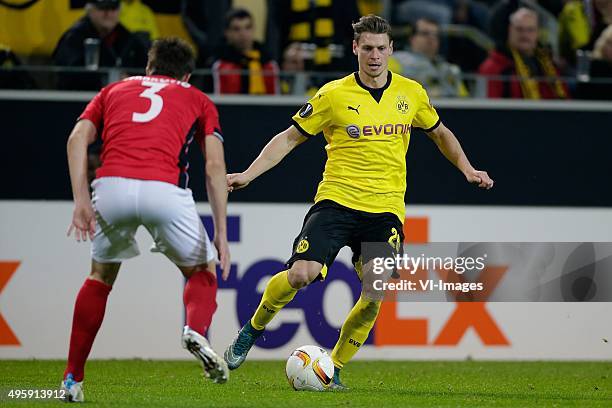 Vojislav Stankovic of Qabala, Lukasz Piszczek of Borussia Dortmund during the Europa League group C match between Borussia Dortmund and Qäbälä FK on...