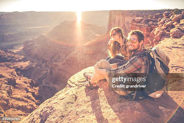 moab hiking couple - canyon utah stock pictures, royalty-free photos & images