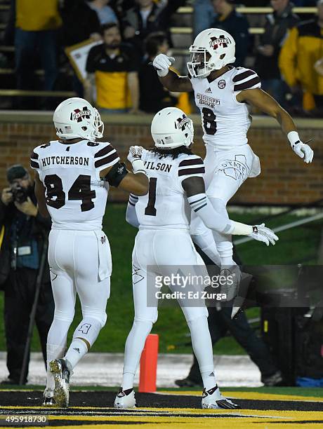 Fred Ross of the Mississippi State Bulldogs celebrates his touchdown with De'Runnya Wilson and Darrion Hutcherson in the first quarter against the...