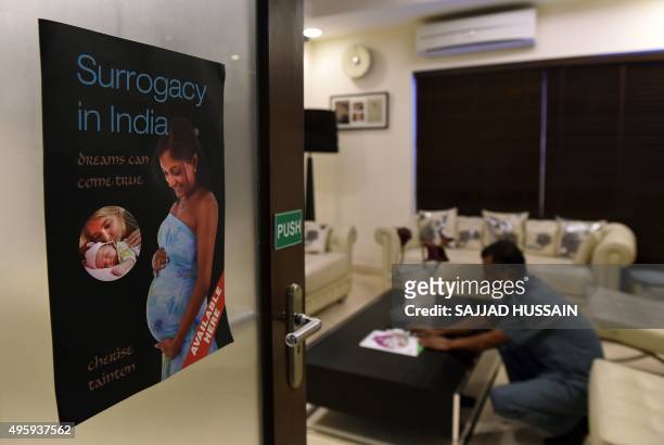 To go with story 'India-politics-health-surrogacy,FOCUS' by Trudy HARRIS In this photograph taken on November 3 a member of staff arranges flowers at...