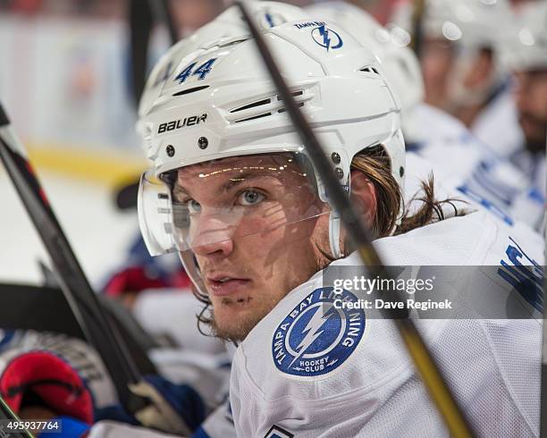 Tye McGinn of the Tampa Bay Lightning watches the action from the bench during an NHL game against the Detroit Red Wings at Joe Louis Arena on...