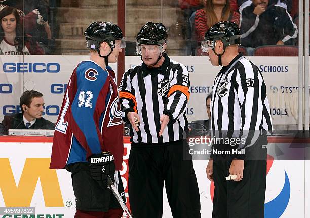 Gabriel Landeskog of the Colorado Avalanche gets an explanation from referee Kevin Pollock and linesman Jay Sharrers on a review of an Arizona...