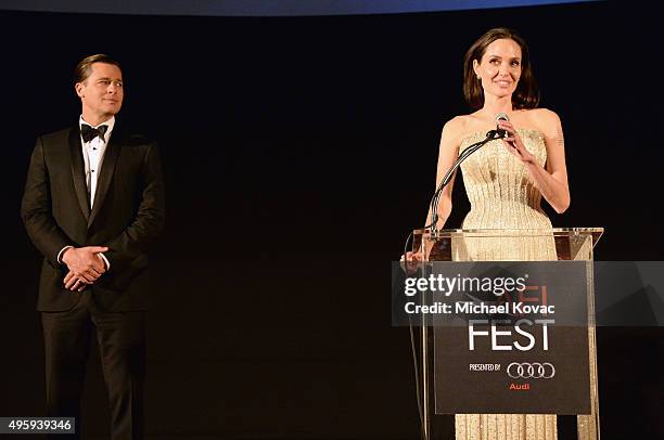 Actor-producer Brad Pitt and writer-director-producer-actress Angelina Jolie Pitt speak onstage during the opening night gala premiere of Universal...