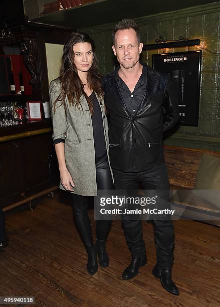 Dean Winters and Guest attend the the after party for the "Spectre" pre-release screening hosted by Champagne Bollinger and The Cinema Society on...
