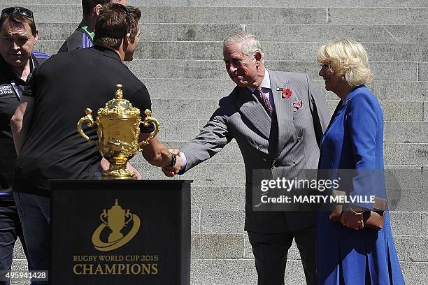 New Zealand's All Blacks All Blacks team captain Richie McCaw meets Britain's Prince Charles and his wife Camilla, the Duchess of Cornwall during a...