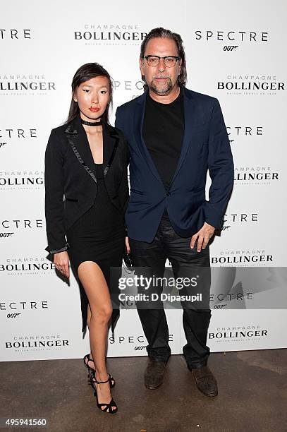 Enga Purevjav and Sante D'Orazio attend the "Spectre" pre-release screening hosted by Champagne Bollinger and The Cinema Society at IFC Center on...