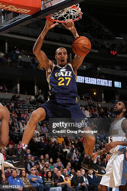 Rudy Gobert of the Utah Jazz dunks the ball against Will Barton of the Denver Nuggets at Pepsi Center on November 5, 2015 in Denver, Colorado. The...